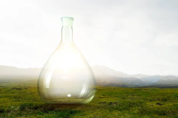 Empty glass bottle . Mixed media — Stock Photo, Image