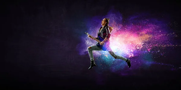 Young and beautiful rock girl playing the electric guitar — Stock Photo, Image
