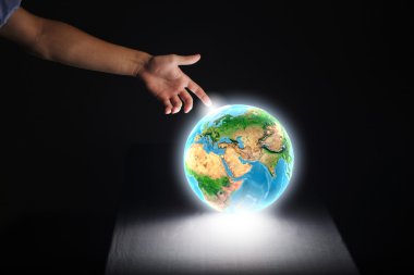Human hand touching Earth planet with finger clipart