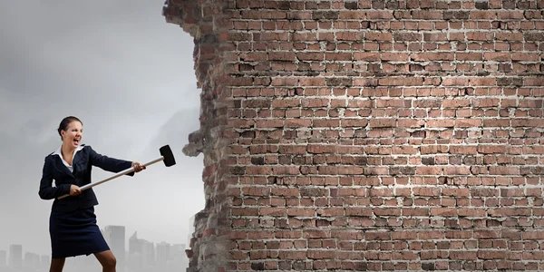 Businesswoman with hammer in hands — Stock Photo, Image