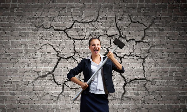 Businesswoman with hammer in hands — Stock Photo, Image