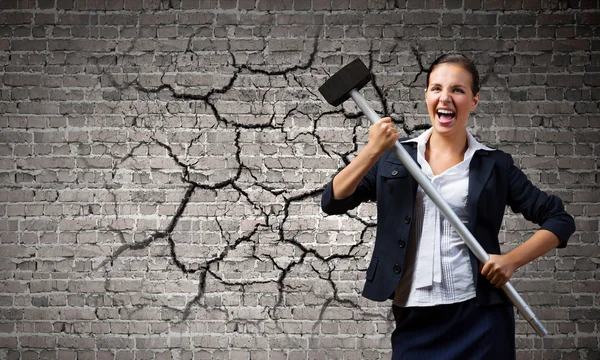 Businesswoman with hammer in hands — Stock Photo, Image