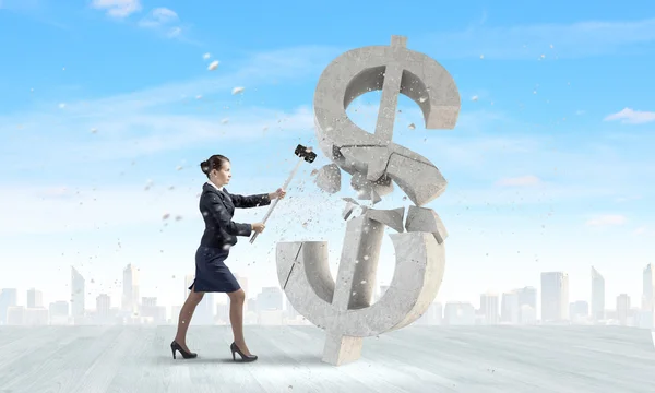 Businesswoman crashing dollar symbol — Stock Photo, Image