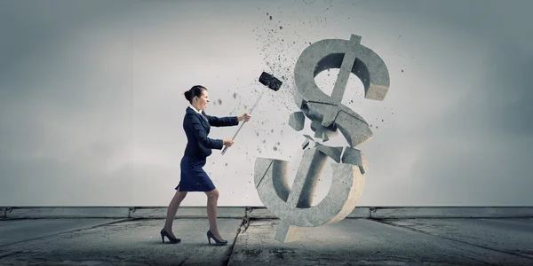 Businesswoman crashing stone dollar — Stock Photo, Image
