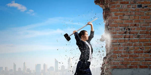 Businesswoman with hammer in hands — Stock Photo, Image