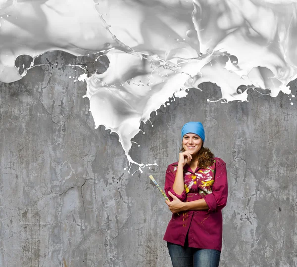 Painter with brush and white splashes — Stock Photo, Image