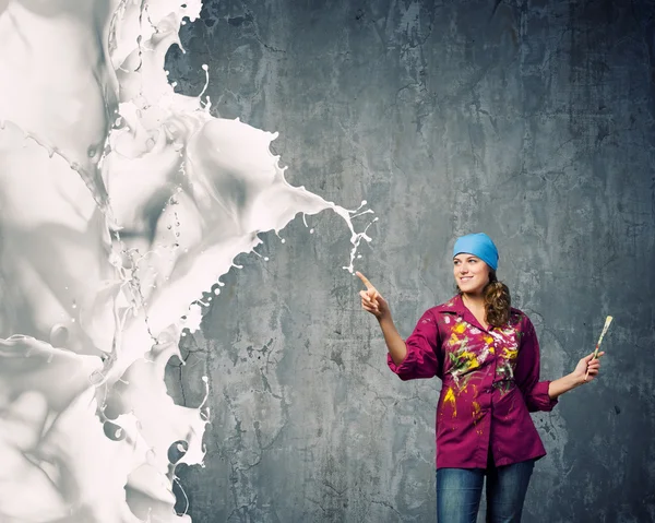 Painter with brush and white splashes — Stock Photo, Image