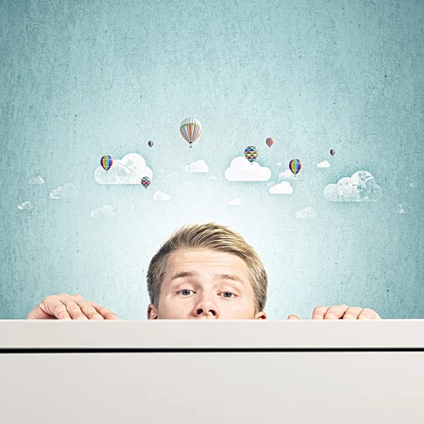 Man looking out from table — Stock Photo, Image