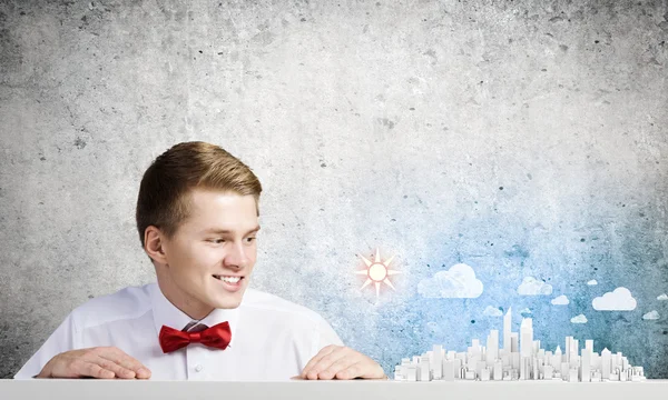 Businessman looking at city model — Stock Photo, Image