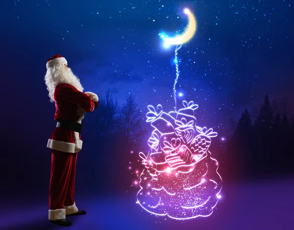 Santa Claus con bolsa de regalos —  Fotos de Stock