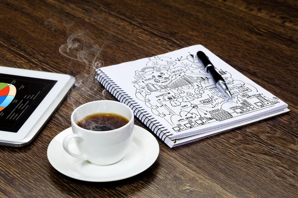 Tablet pc, cup of coffee and notepad — Stock Photo, Image