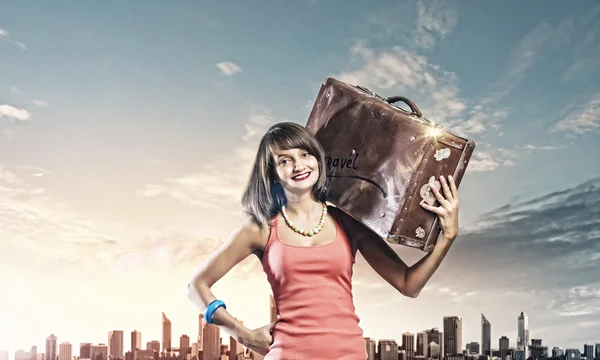 Woman with suitcase walking on road — Stock Photo, Image