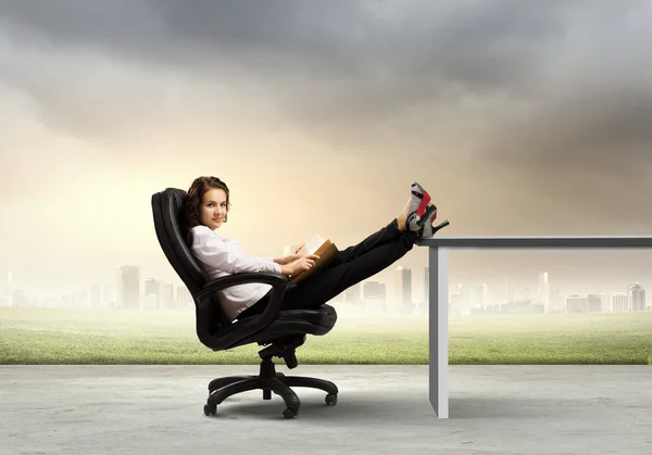 Businesswoman sitting in chair — Stock Photo, Image