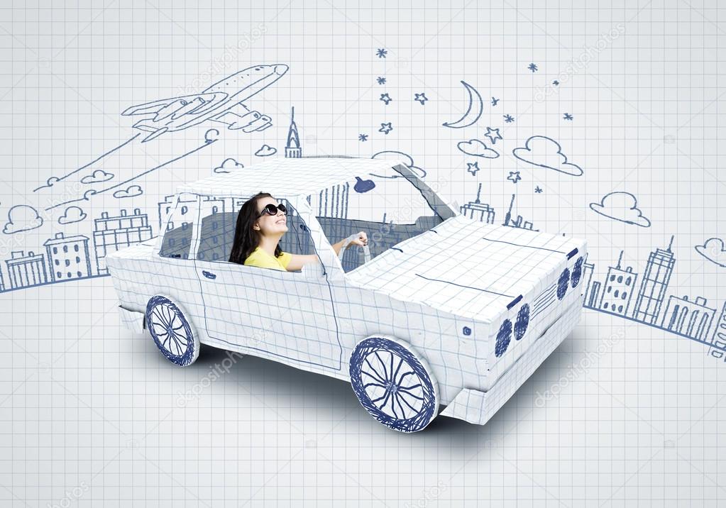 Woman riding car made of paper