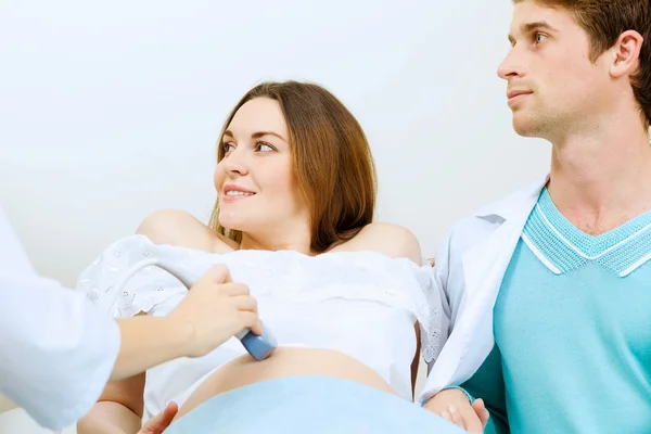 Pregnant woman examined by doctor — Stock Photo, Image