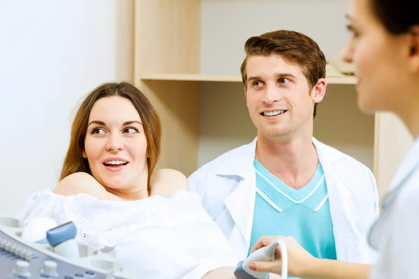 Pregnant woman examined by doctor — Stock Photo, Image