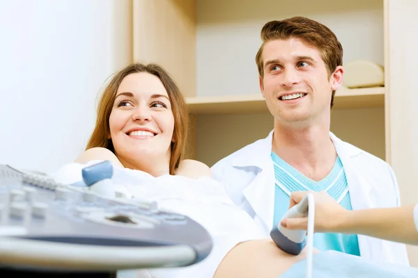 Pregnant woman examined by doctor — Stock Photo, Image