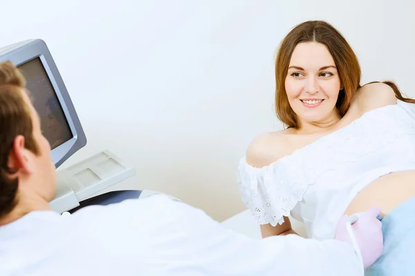 Pregnant woman examined by doctor — Stock Photo, Image