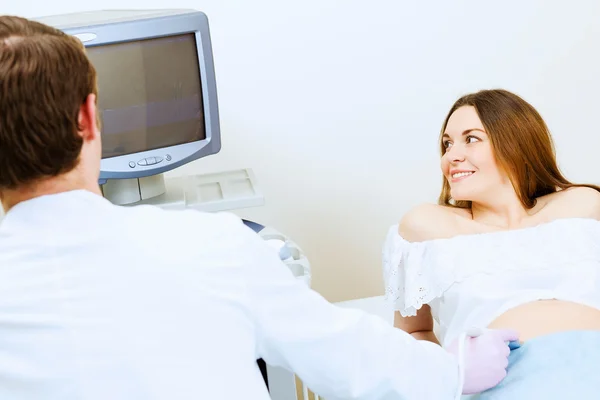 Pregnant woman examined by doctor — Stock Photo, Image