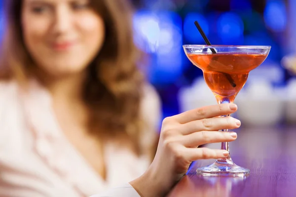 Girl at bar drinking cocktail Royalty Free Stock Photos