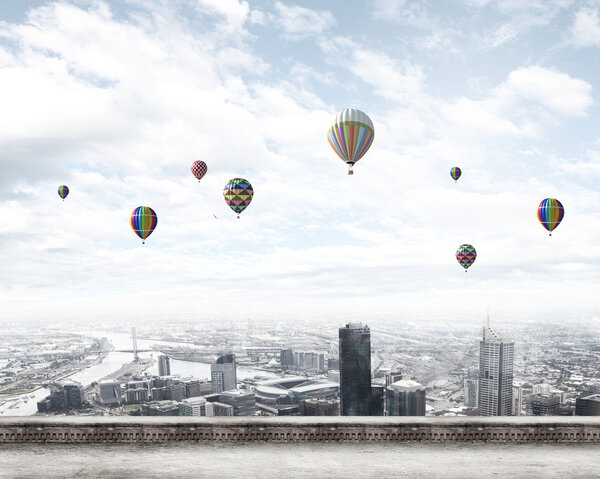 Balloons flying high in sky