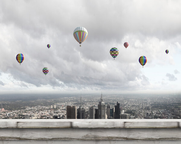 Balloons flying high in sky