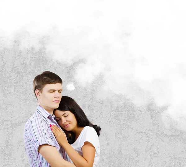 Young couple hugging each other — Stock Photo, Image