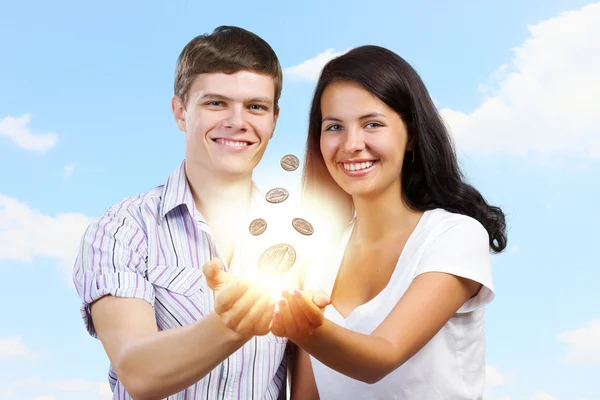 Happy couple holding cent — Stock Photo, Image