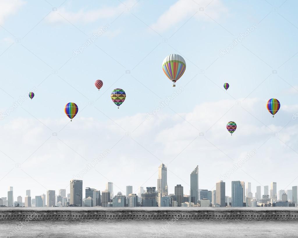 Balloons flying high in sky