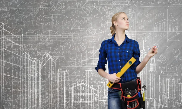 Woman mechanic with ruler in hand — Stock Photo, Image