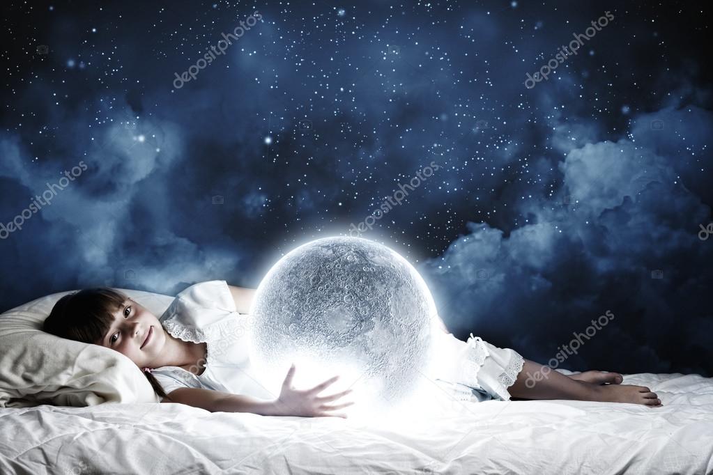 Girl lying in bed with moon