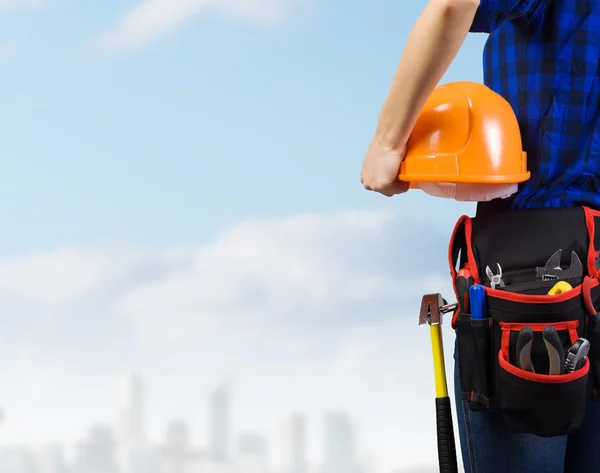 Woman mechanic with yellow helmet — Stock Photo, Image