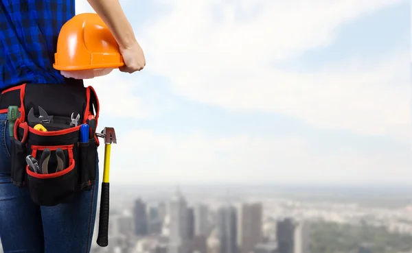 Woman mechanic with yellow helmet — Stock Photo, Image