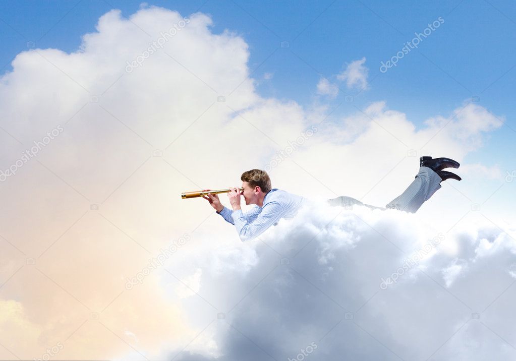 Young businessman flying in sky