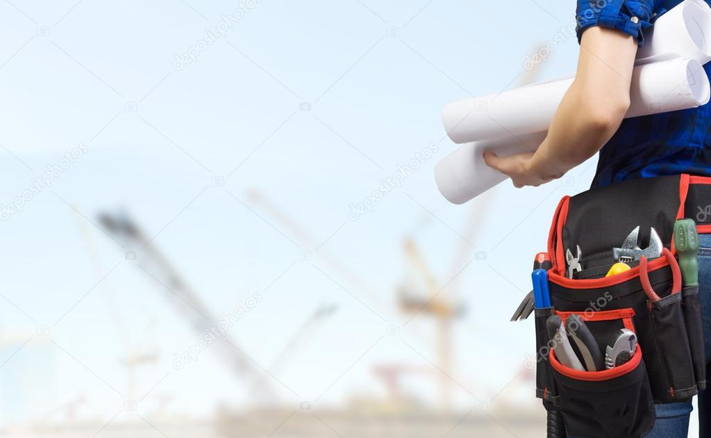 Woman mechanic with yellow helmet