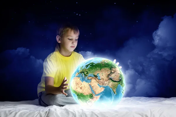 Boy holding Earth planet — Stock Photo, Image