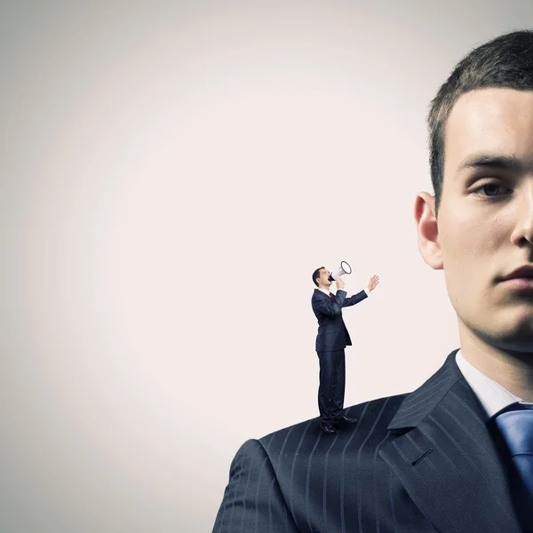 Businessman screaming in megaphone — Stock Photo, Image