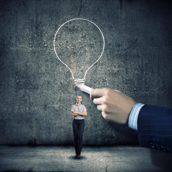 Businesswoman looking at business sketch — Stock Photo, Image