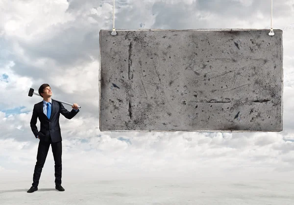 Businessman with hammer in hands — Stock Photo, Image