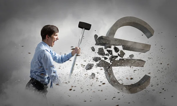 Businessman crashing hammer euro symbol — Stock Photo, Image