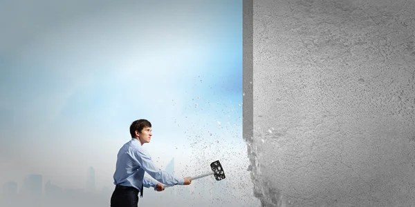 Businessman with hammer in hands — Stock Photo, Image