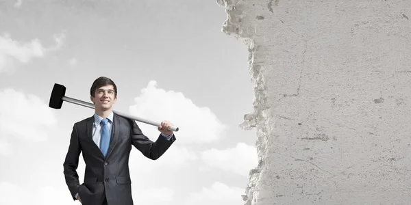 Businessman with hammer in hands — Stock Photo, Image