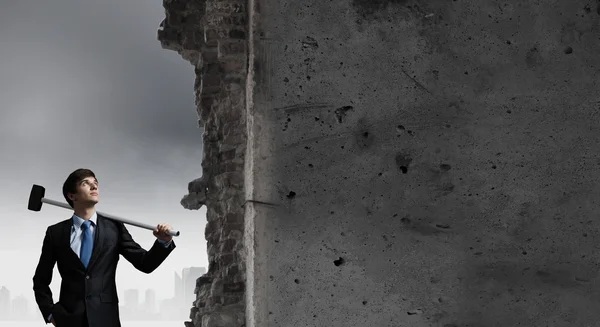 Businessman with hammer in hands — Stock Photo, Image