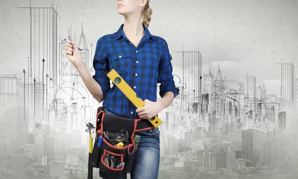 Woman mechanic with ruler in hand — Stock Photo, Image