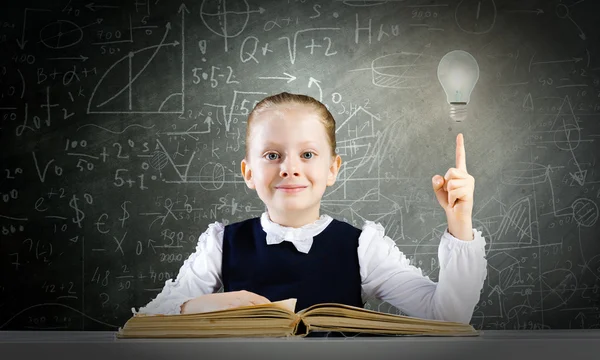 Schoolgirl having idea — Stock Photo, Image