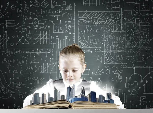 School girl looking in opened book — Stock Photo, Image