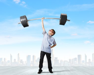 Boy lifting barbell above head clipart