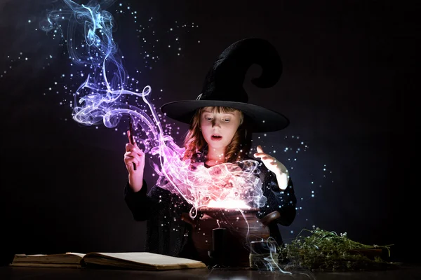 Little witch reading conjure — Stock Photo, Image