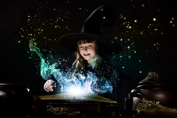 Little witch reading conjure — Stock Photo, Image