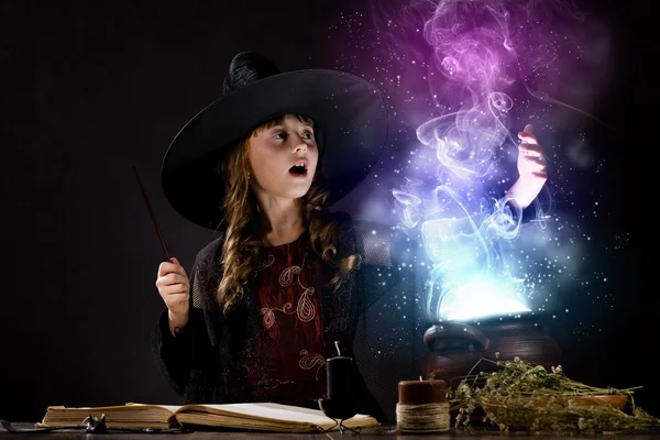 Little witch reading conjure — Stock Photo, Image